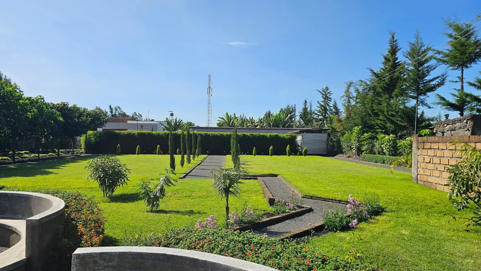 Completed residential garden with lawns, pathways and planted borders