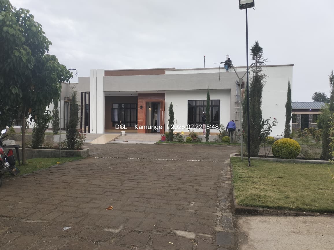 Front elevation and landscaped approach to the completed Nakuru bungalow